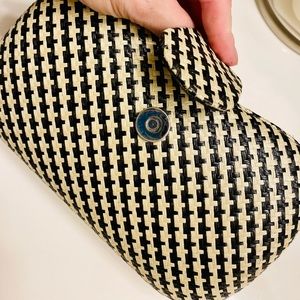 Beautiful clutch gently loved. Inside cloth lining shows little signs of wear.